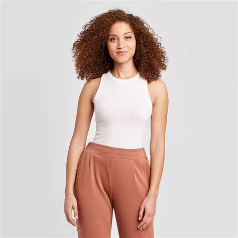 This crewneck <b>tank</b> features a simple design that allows for easy mixing and matching with layering pieces and bottoms in your closet. . Target new day tank top